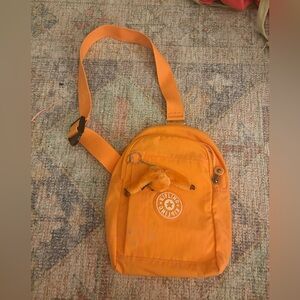 Kipling Klynn Sling Backpack in orange nylon
